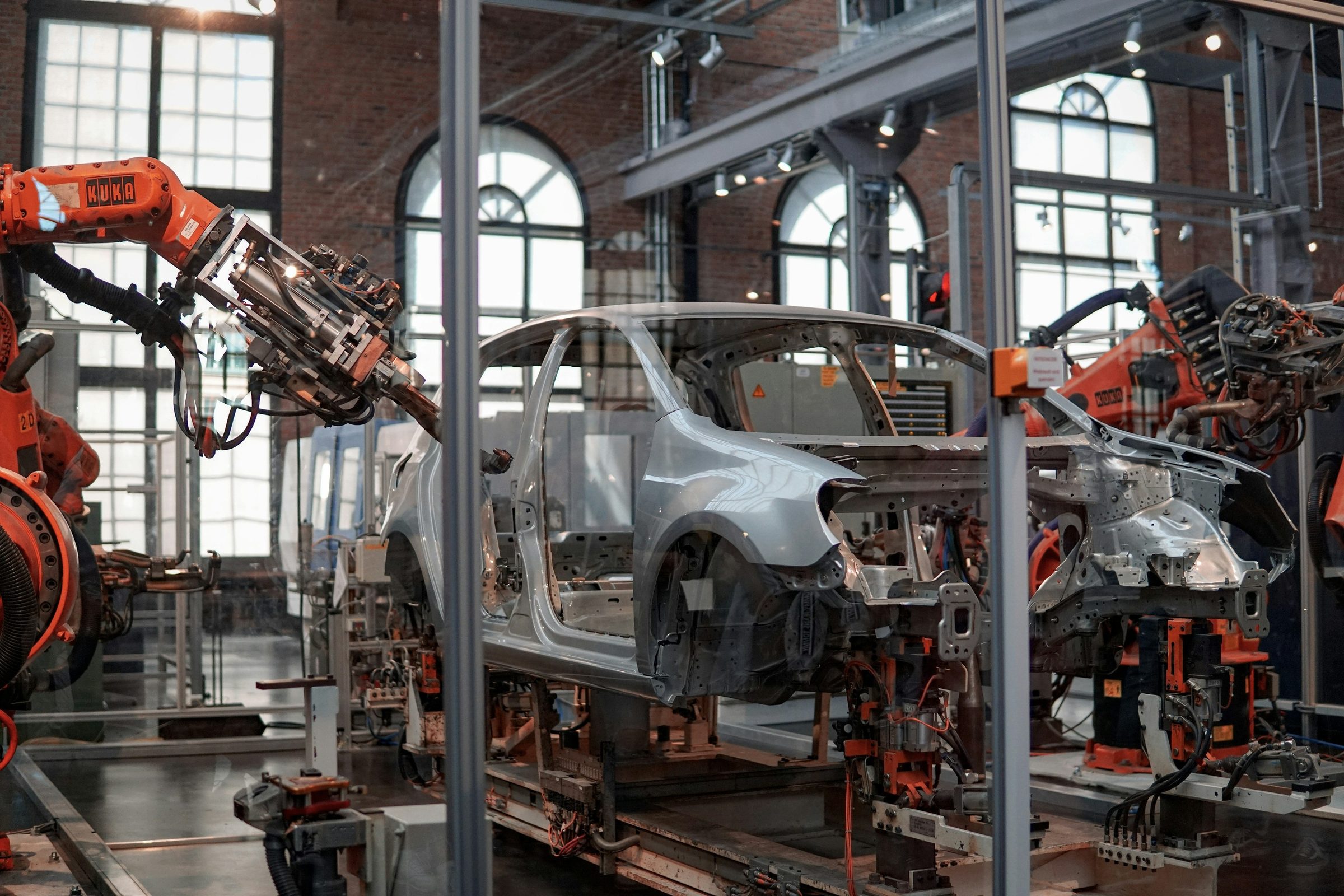 Vehicle body assembled by robots in a factory. Photo: Lenny Kuhne / Unsplash