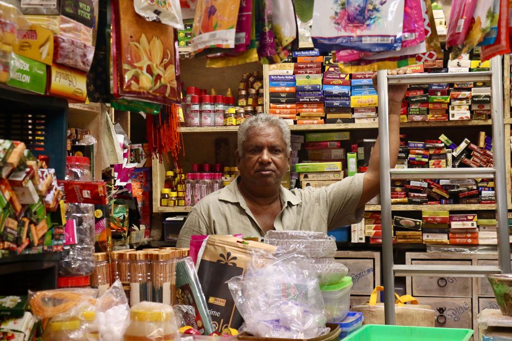 A shopkeeper in a well-stocked kirana store. Photo: Pexels contributor / Pexels