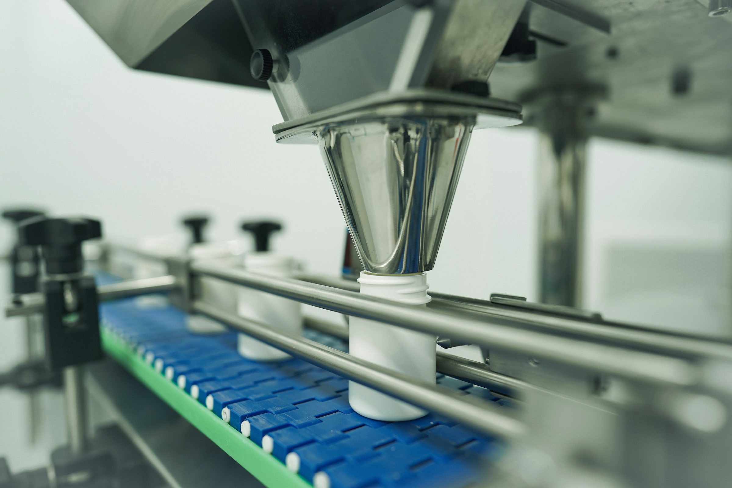 Bottles filled on an automated production line. Photo: Mina Rad / Unsplash